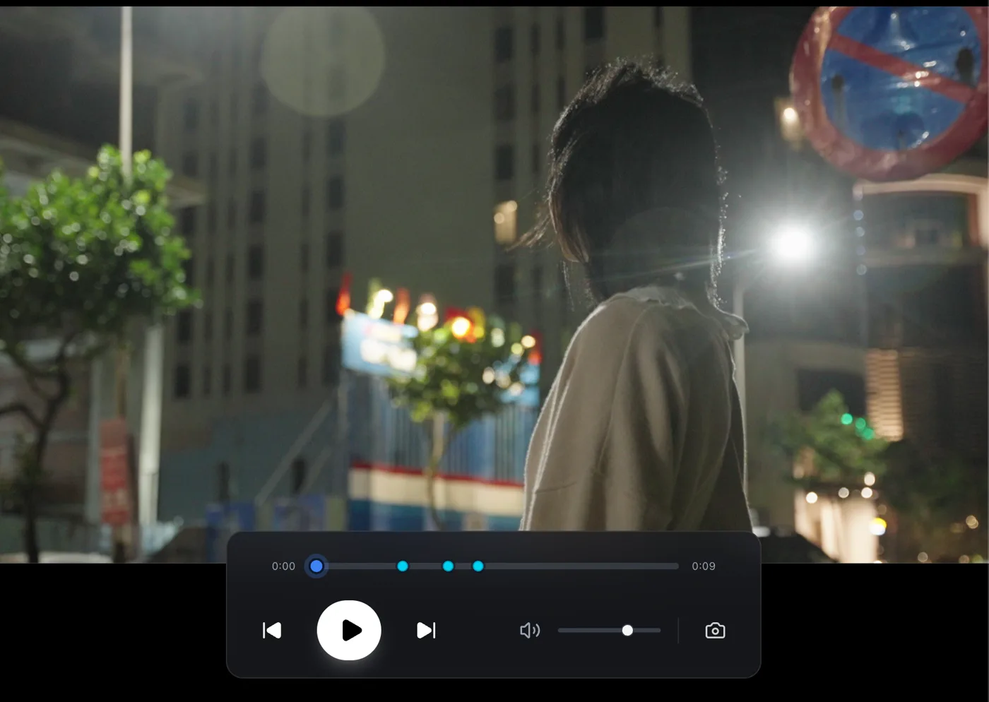 A graded night-time frame in the CineSnap viewer, with the transport bar below showing snapshot markers along the timeline.