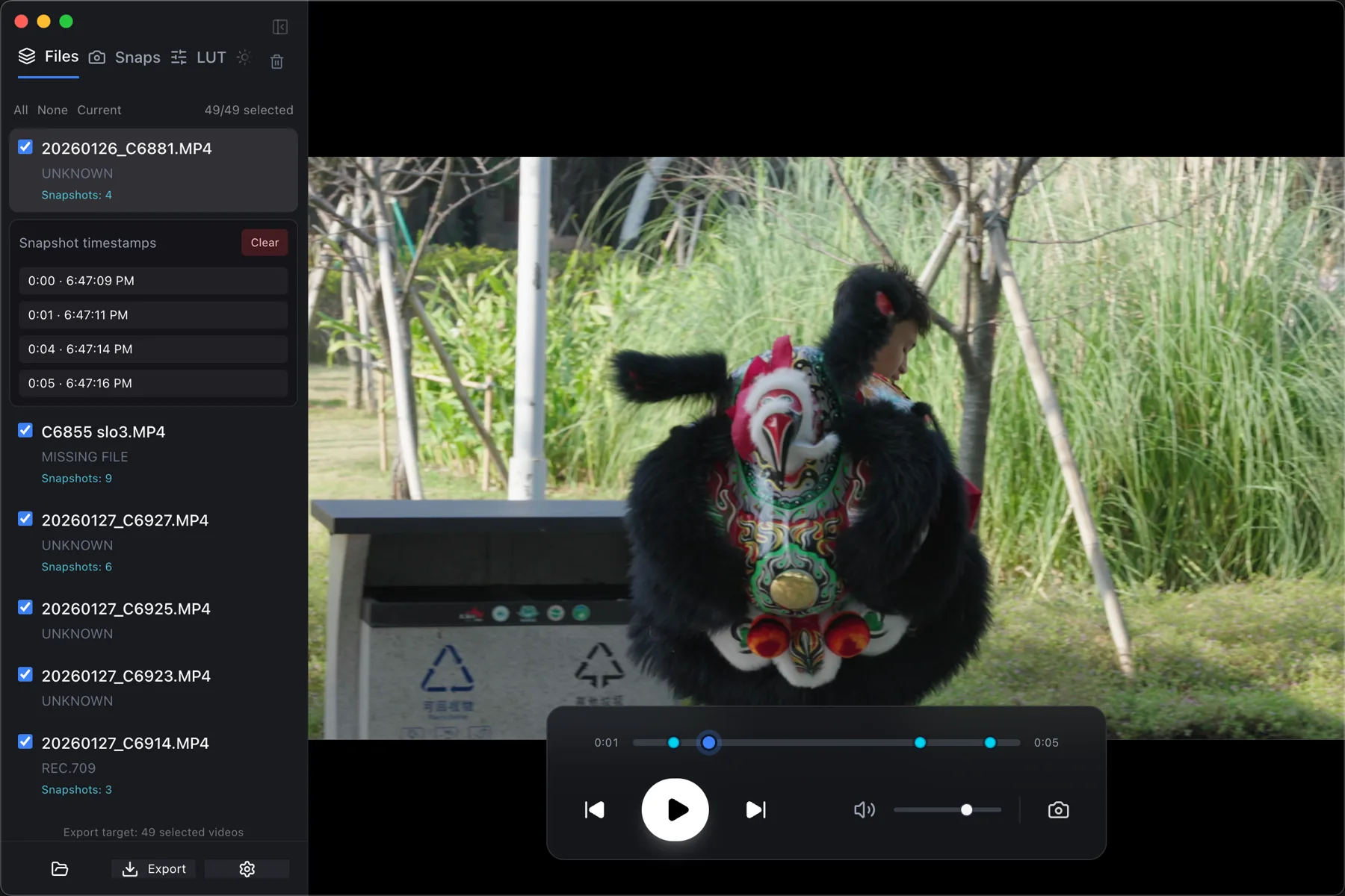 The CineSnap window: a playlist on the left showing each clip's detected colour space and snapshot count, an expanded list of snapshot timestamps, and a graded frame filling the viewer.